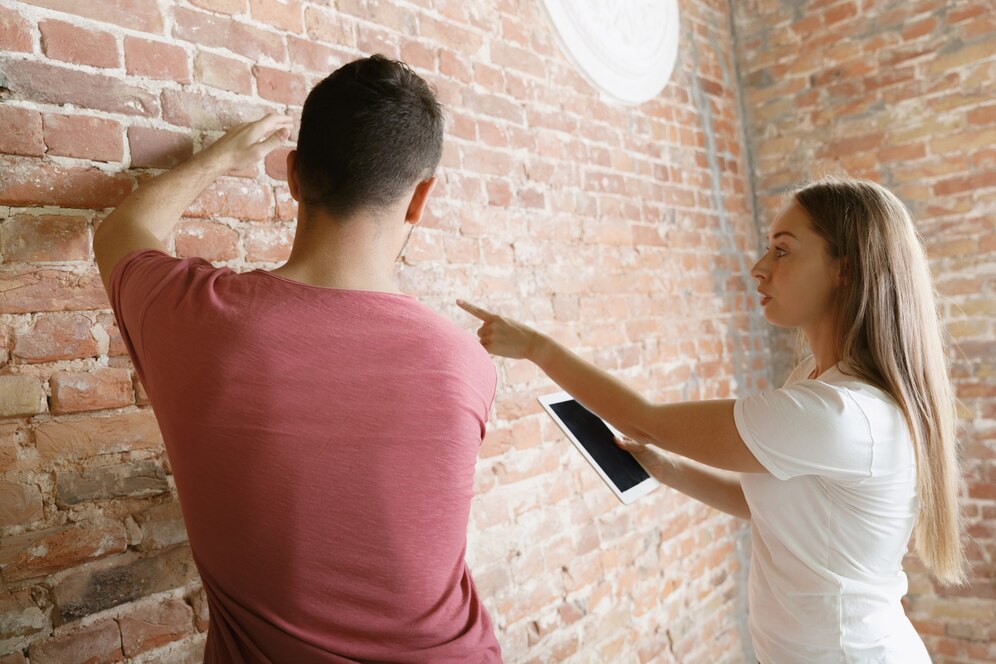young-couple-doing- plaster repair for historic homes